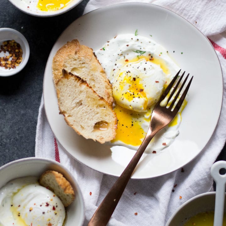 Turkish Eggs - Poached Eggs on top of garlic dill yogurt with a chili butter sauce | Sarcastic Cooking